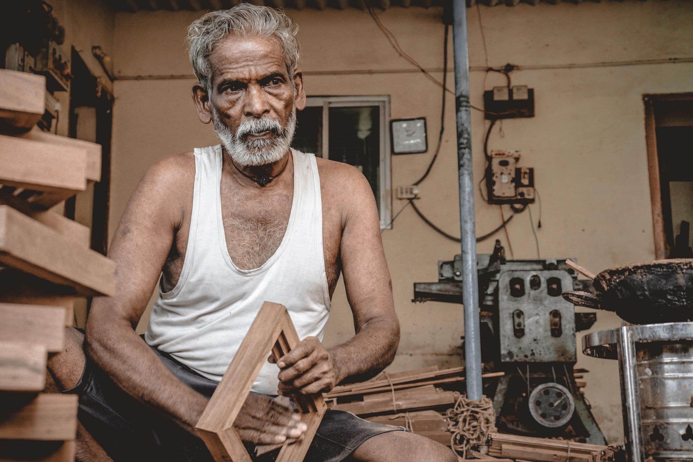 A carpenter with door frames in the workshop